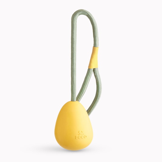 Beco - Slinger pebble | Äggformad boll med rep (Gul eller orange)